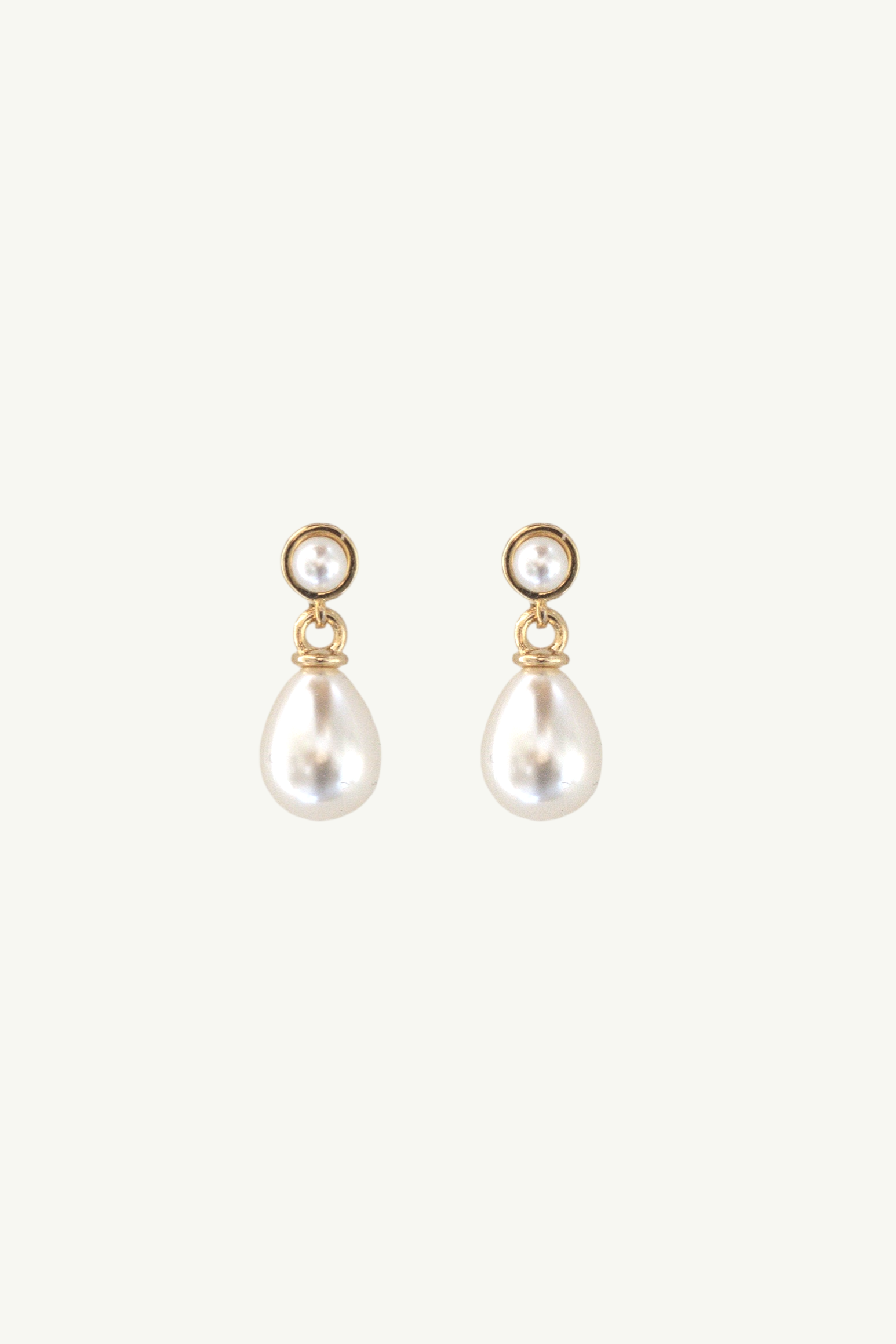 Flat photo of the micro pearl drop earrings by AB Ellie Studio Bride collection on white background
