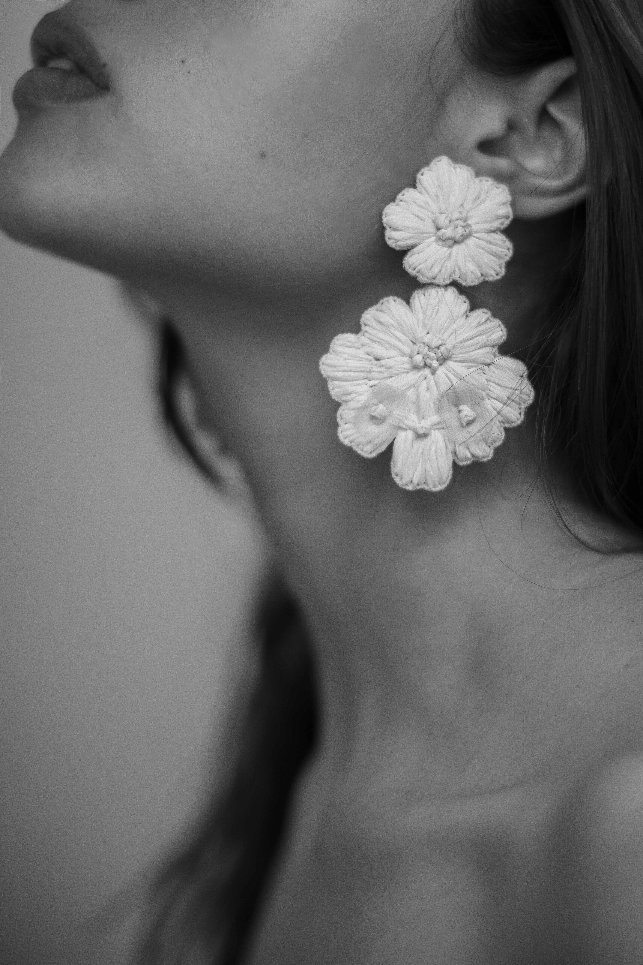 Black and white close up of the ivory statement floral earring
