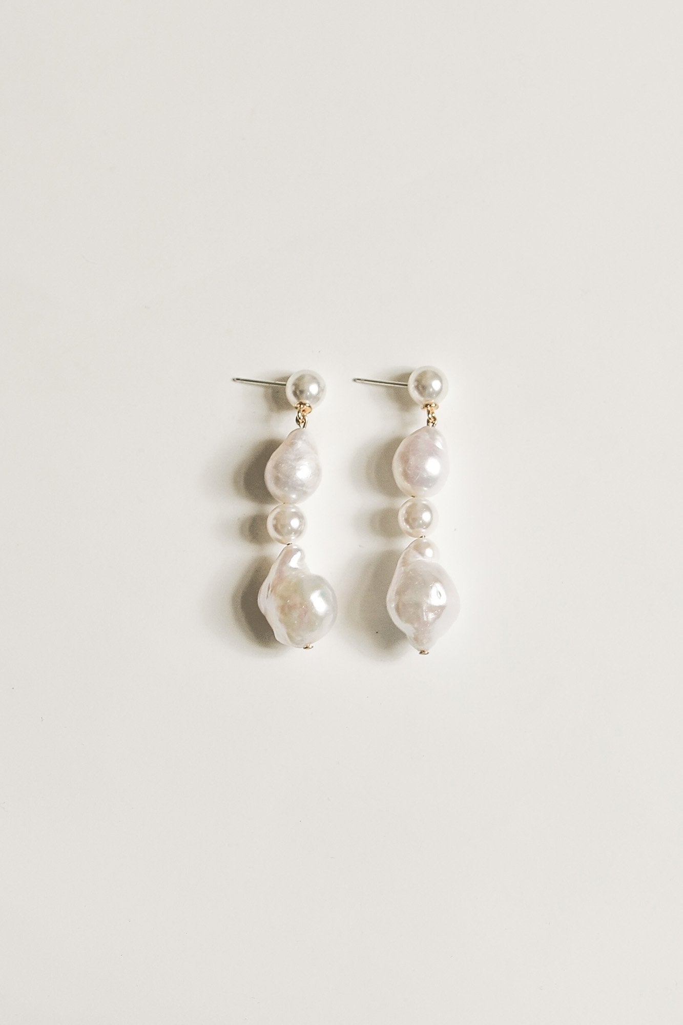 Vertical flat image of freshwater pearl drop earrings by A.B. Ellie