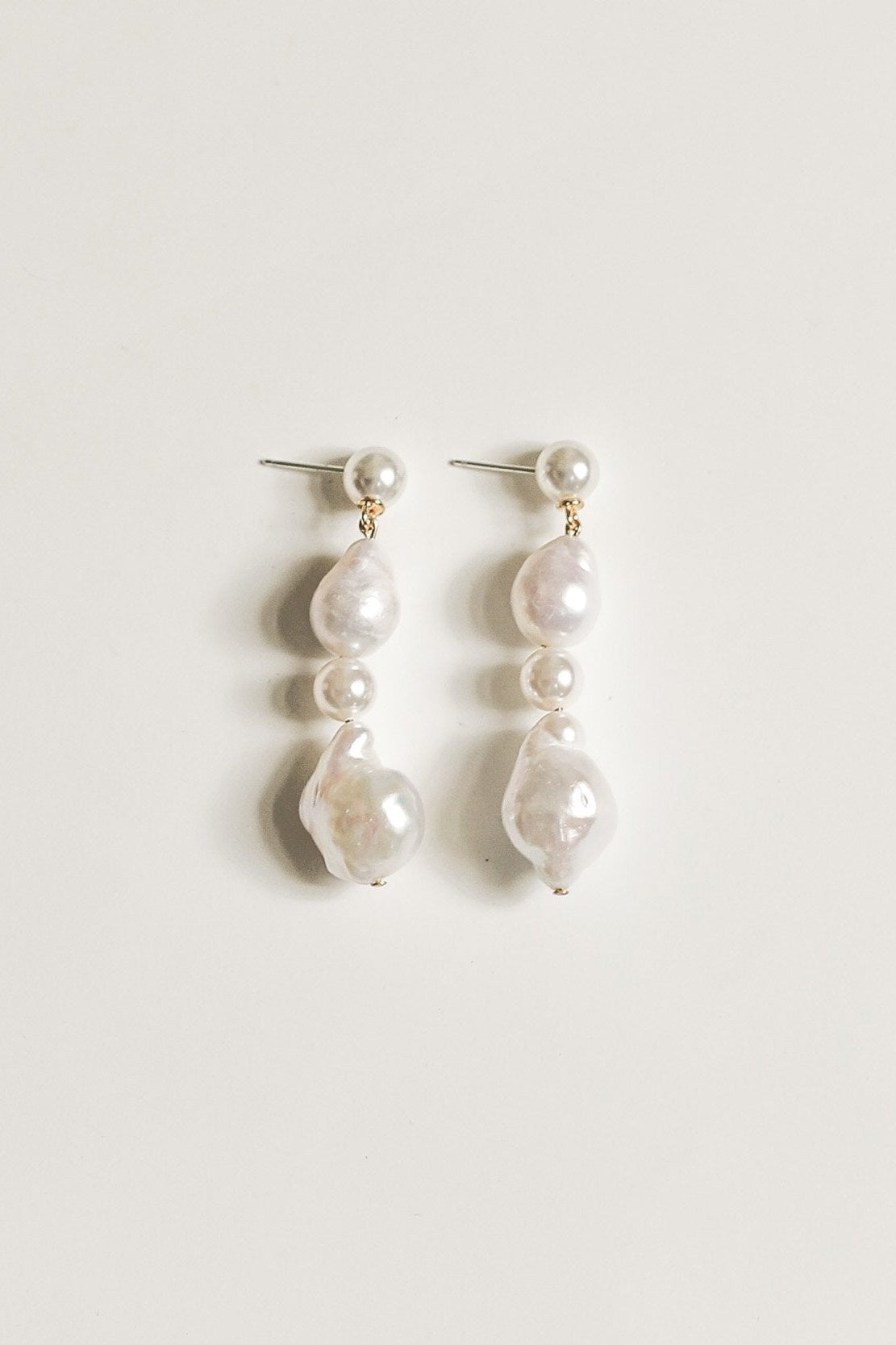 Flat image of freshwater pearl drop earring pair by A.B. Ellie