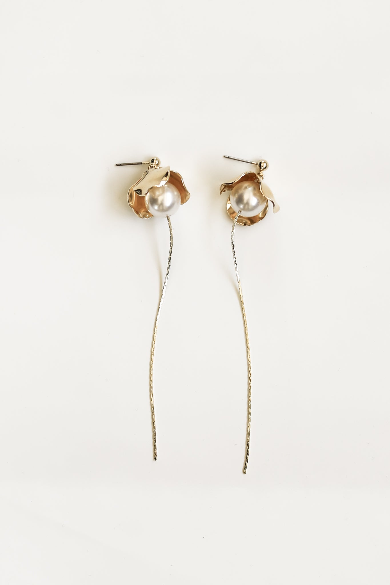 Flat image of Bardot strand pearl earrings by AB Ellie on white background