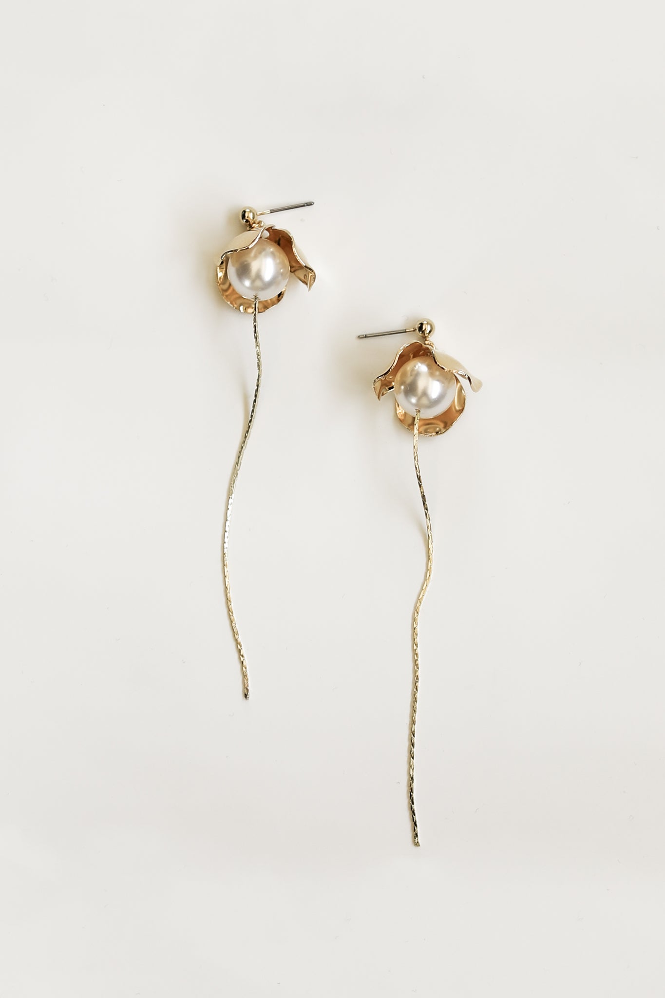 Flat image of the Bardot strand gold earrings by AB Ellie on white background