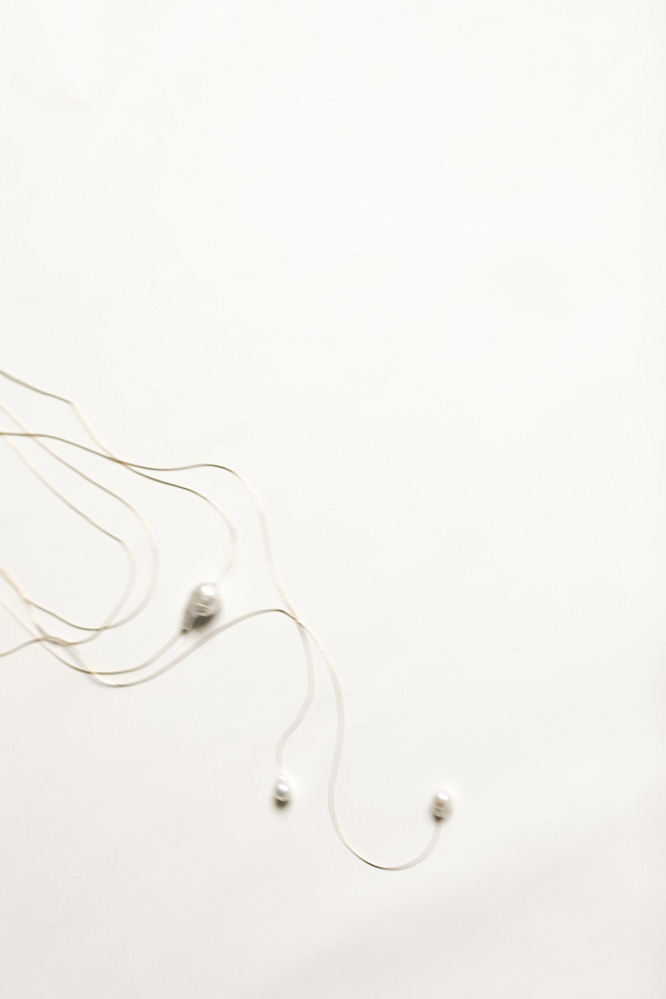 Flat image of the baroque pearl necklace by AB Ellie on a white background