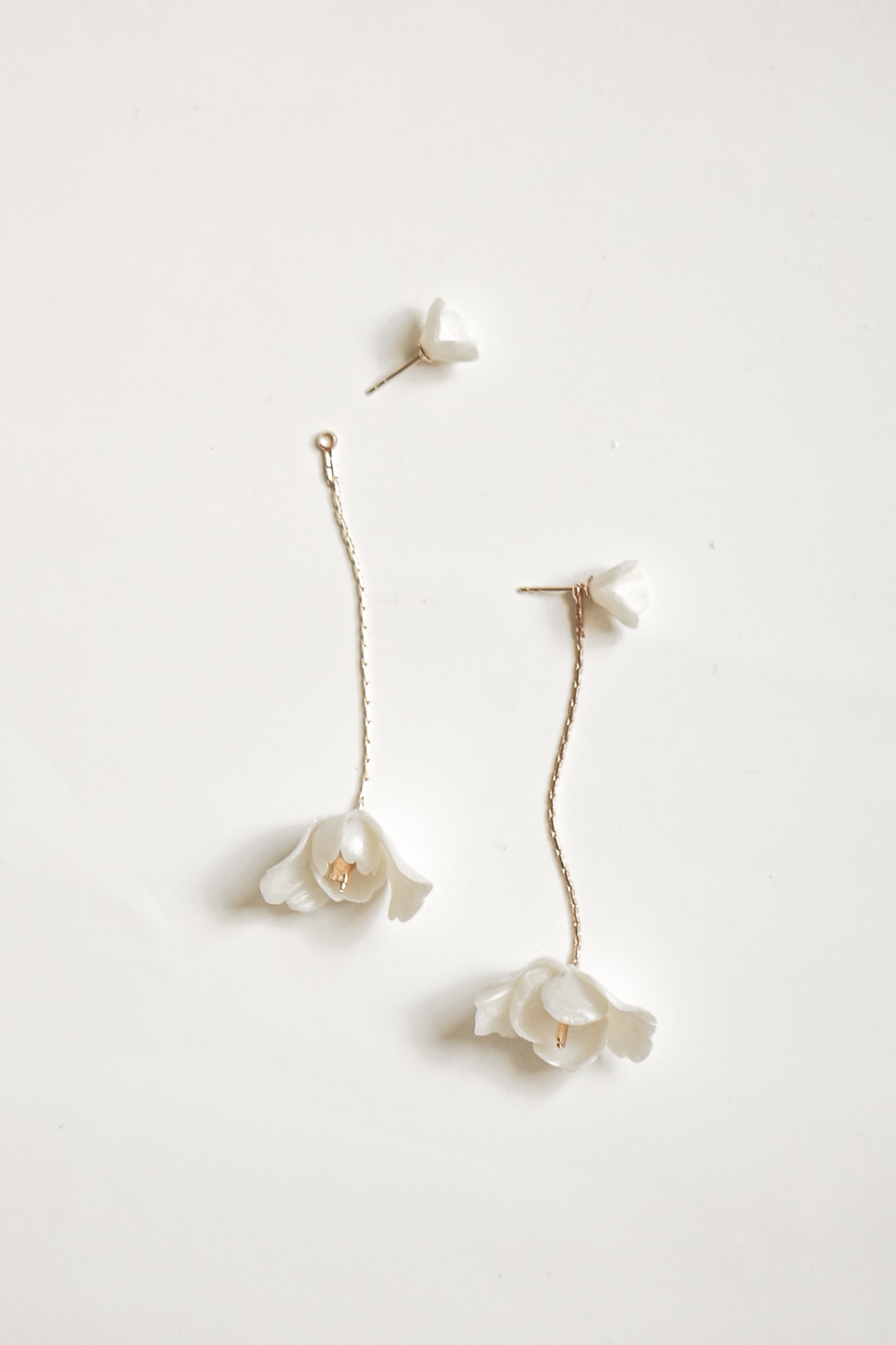 Photo of the blossom 2 in 1 strand showing the stud and strand separated on a white background
