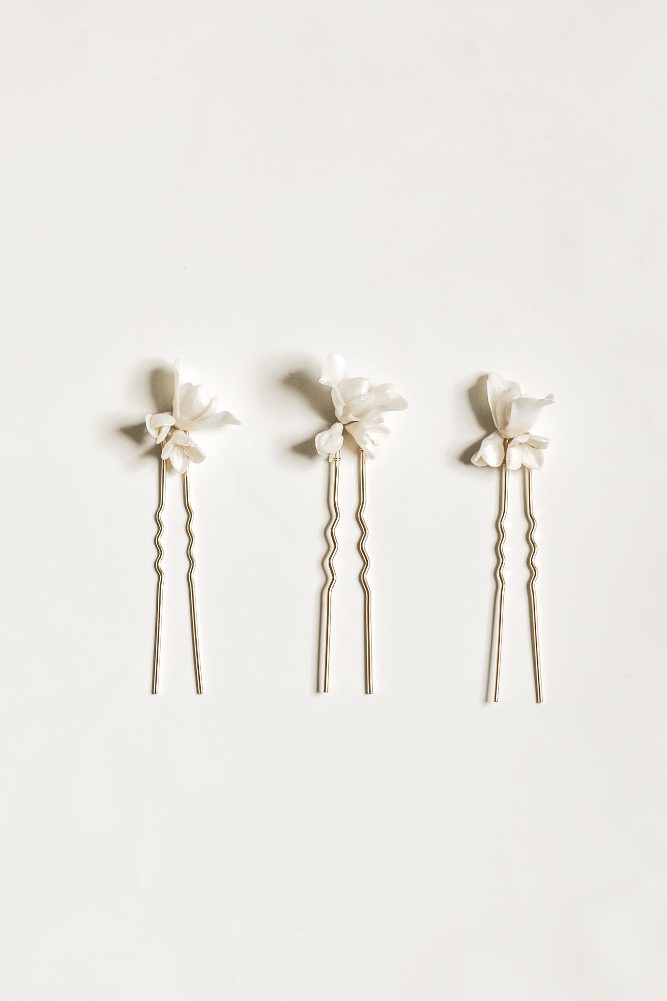 Photo of the blossom hairpin trio by AB Ellie on white background