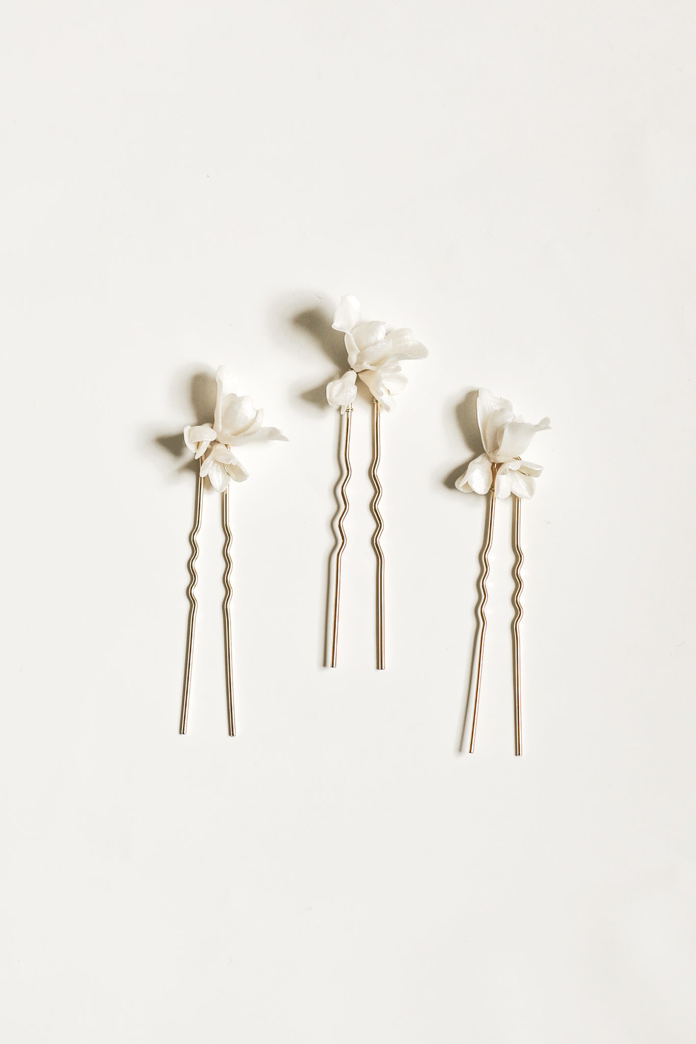 Flat photo of the Blossom hairpin trio by AB Ellie on white background