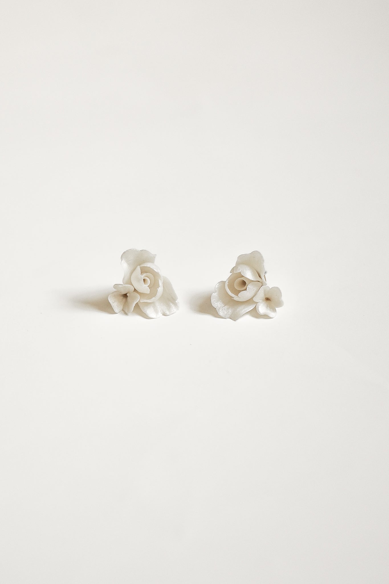 Flat image of the ivory Blossom Floral stud earrings by AB Ellie on a white background