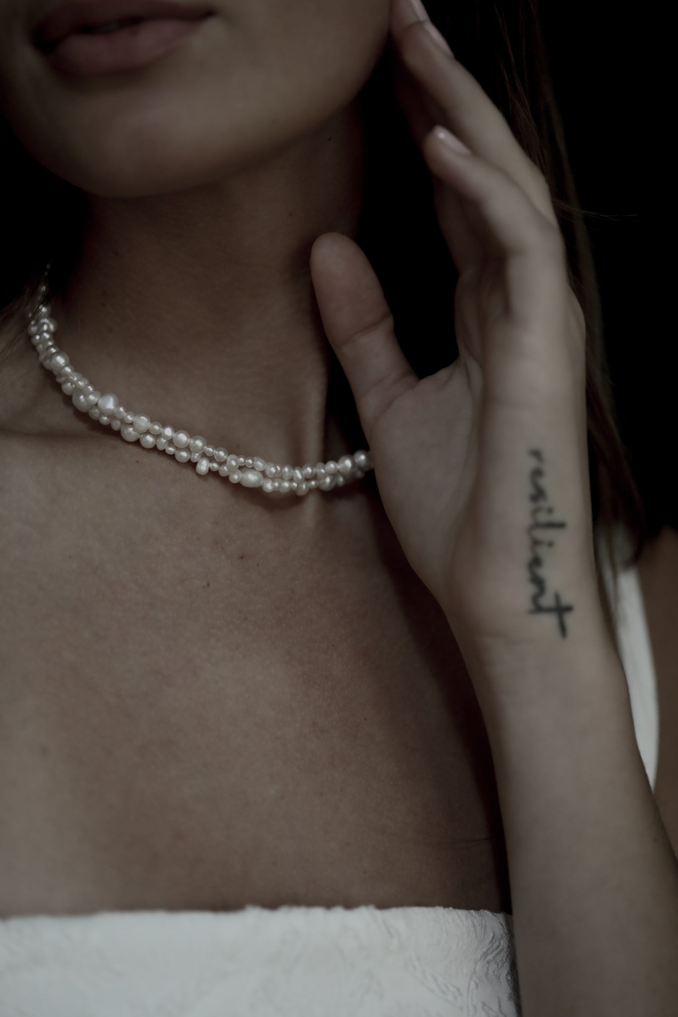 Close up front view photo of brunette bride wearing the freshwater pearl double strand necklace by AB Ellie