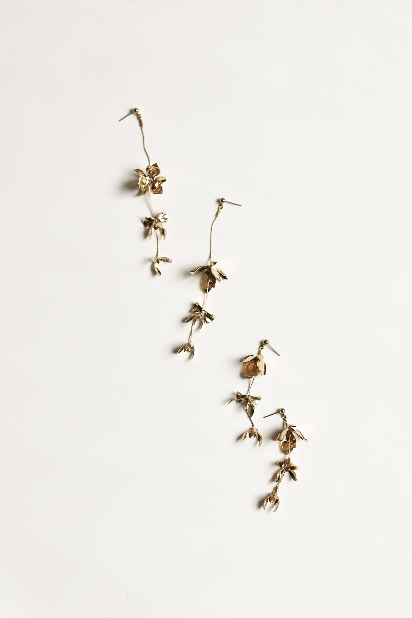 Flat image of the full and half length Magnolia strand earrings by A.B. Ellie compared side by side