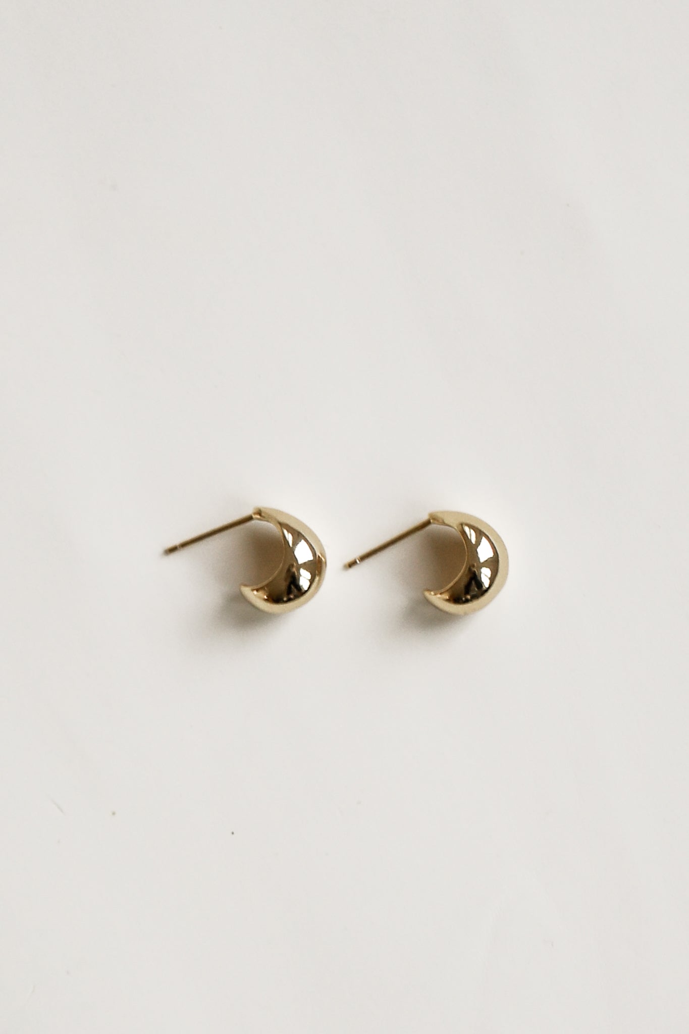 flat photo of the micro orb gold earrngs by AB Ellie