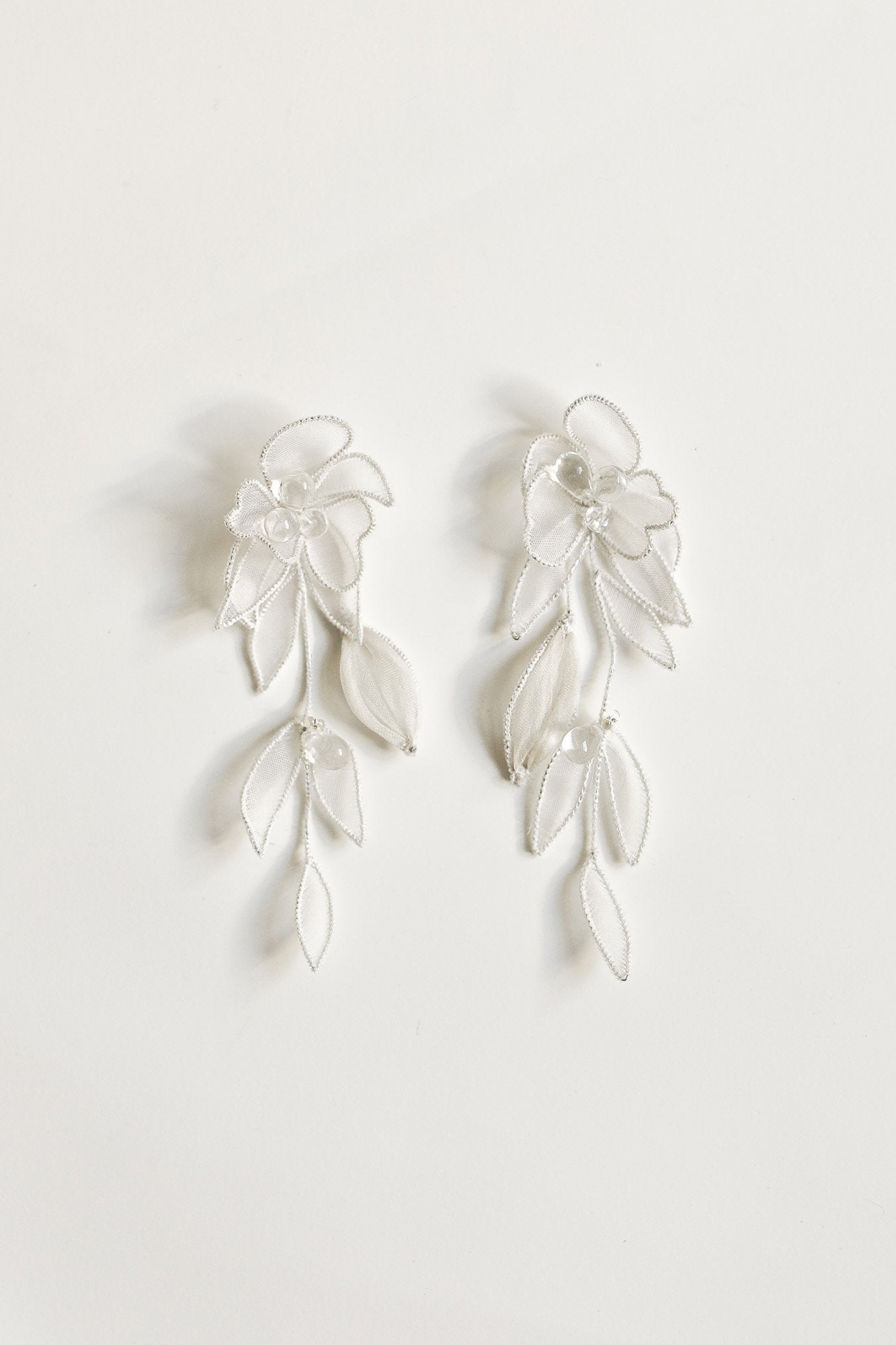Flat photo of the mini charlee tier earrings by AB Ellie on white background