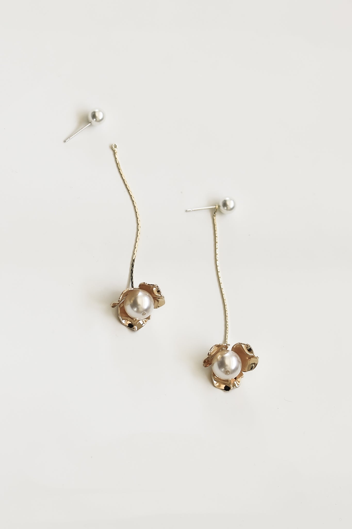 Flat image of the 2 in 1 Gold & pearl bridal earring by AB Ellie on white background