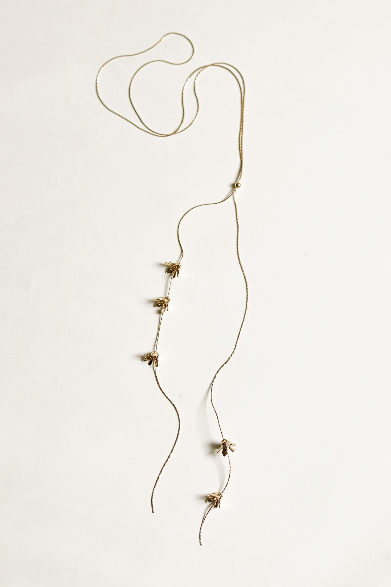 Flat image of Run Bolo lariat necklace by AB Ellie on white background