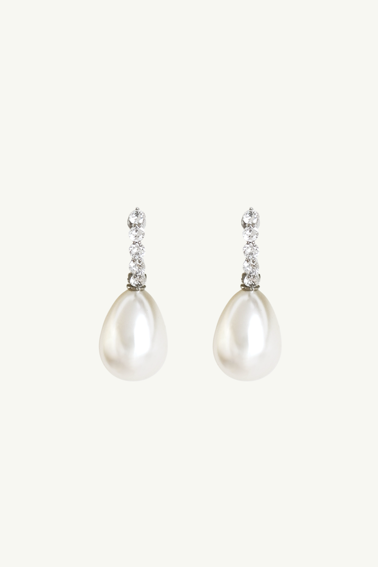 Flat photo of the silver clip on pave pearl drop earrings by AB Ellie
