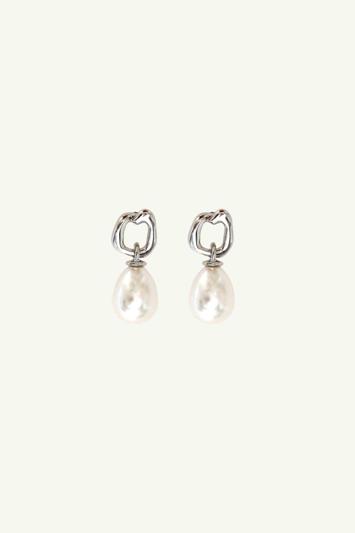 Flat image on white background of the silver gilded mini hoop pearl drop earrings