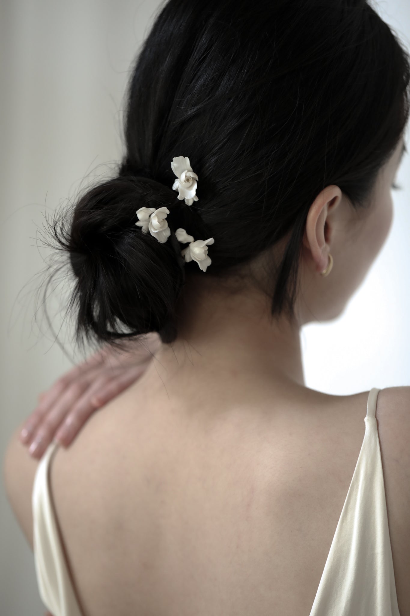 Photo of dark haired bride wearing the Blossom hairpin trio by AB Ellie