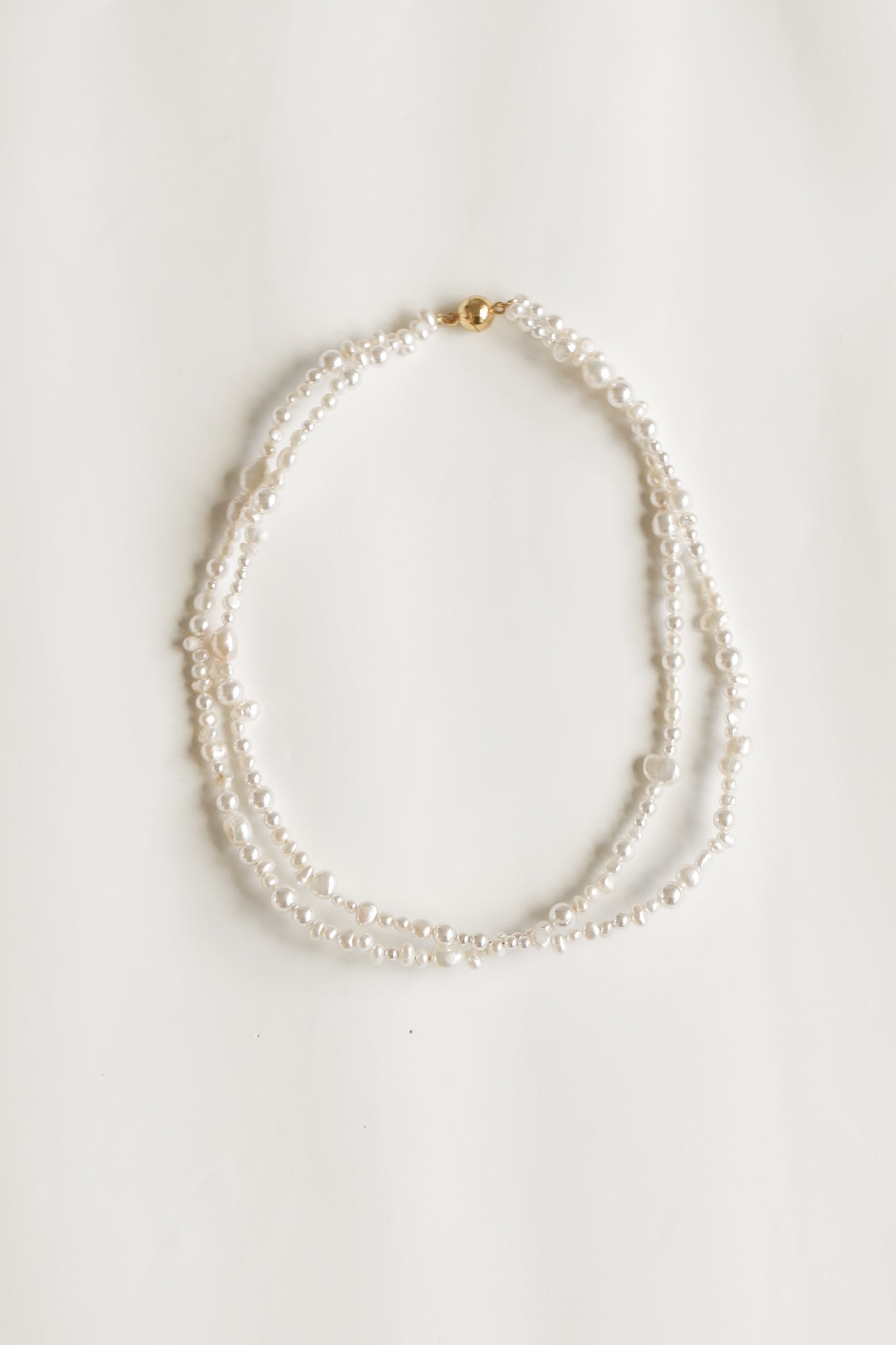Flat photo of the freshwater pearl double strand necklace by AB Ellie on white background
