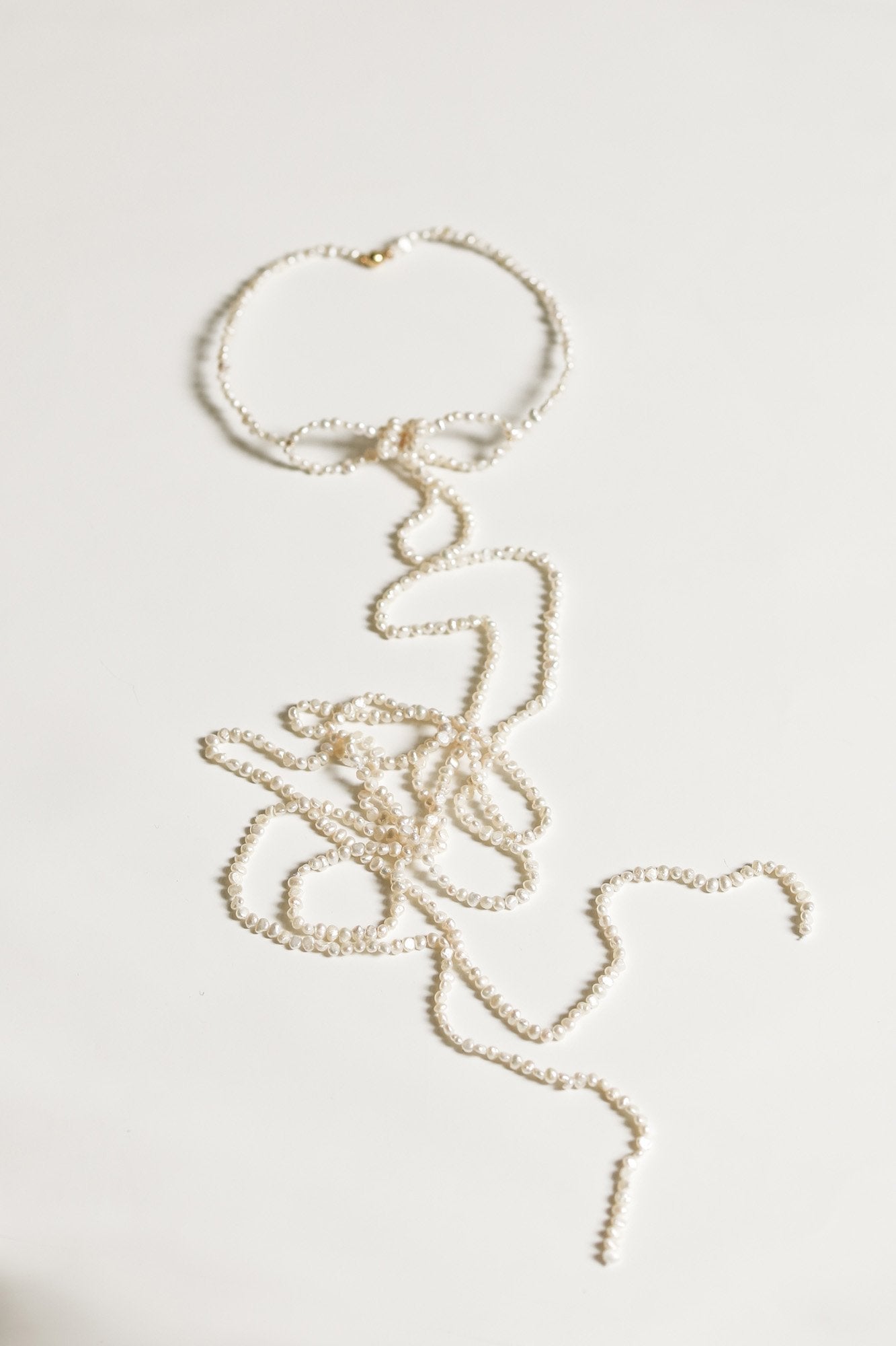 freshwater-pearl-keshi-bow-tassel-necklace-by-ab-ellie.jpg