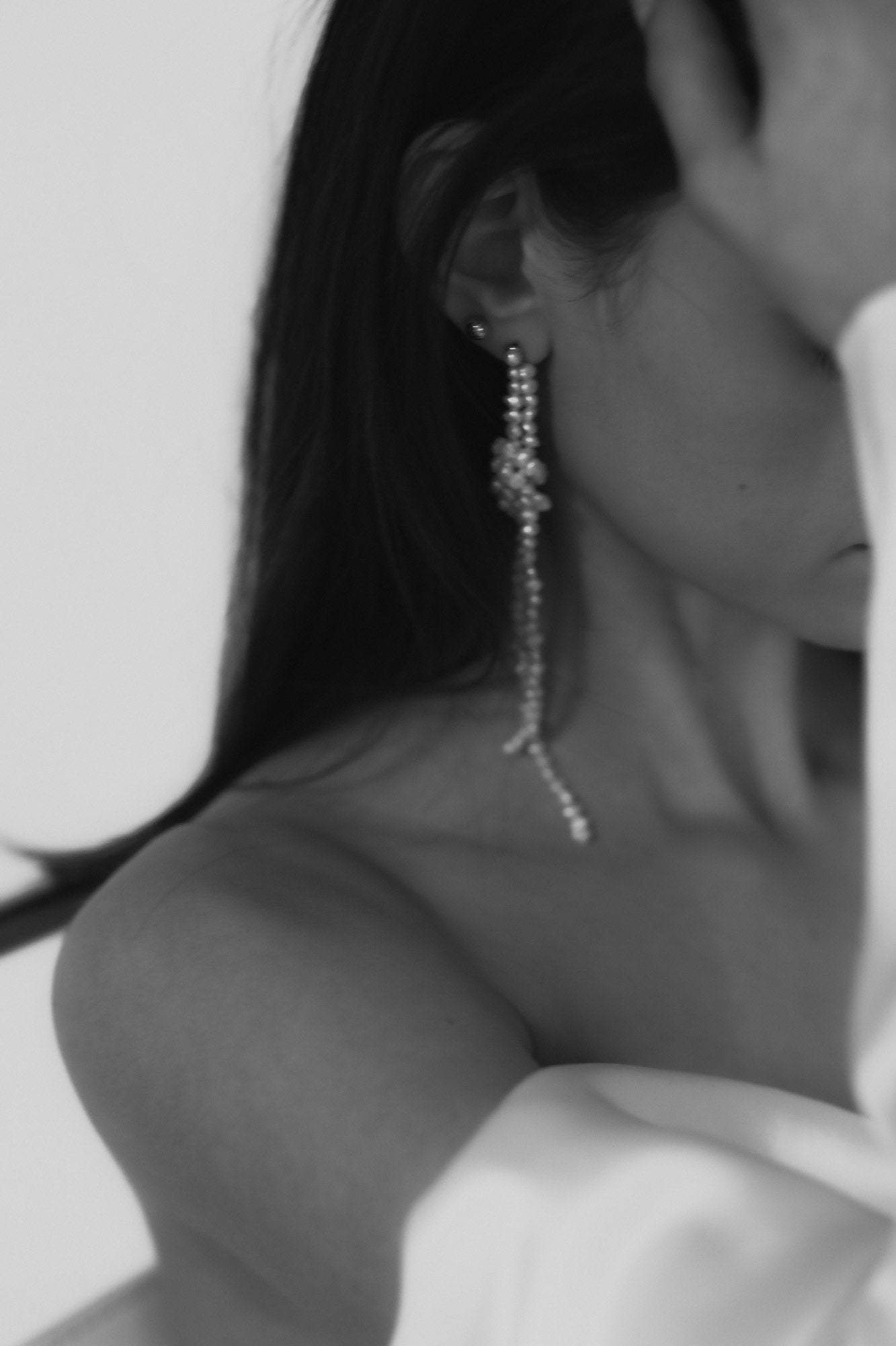 Black and white phot of bride wearing the freshwater pearl knotted strand earrings by AB Ellie