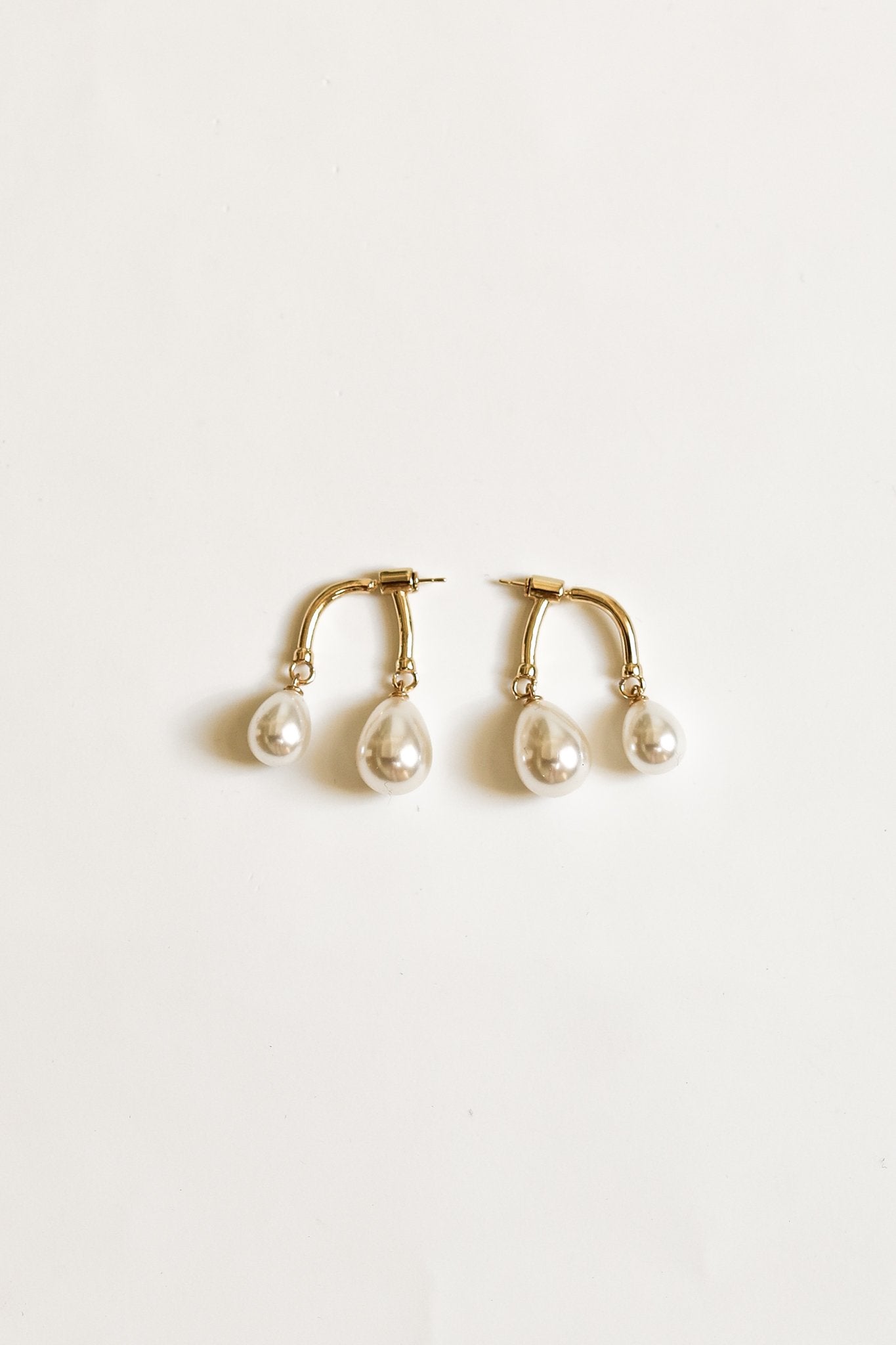 gold-asym-gilded-pearl-drops-earring-by-abellie-1.jpg