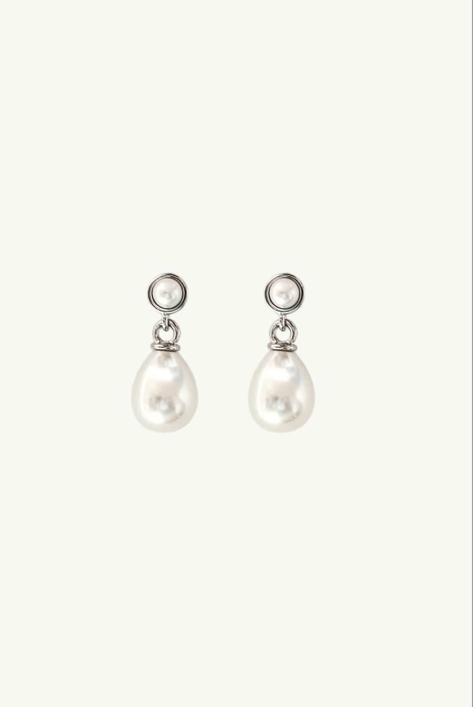 Flat photo of the micro pearl drop silver earrings by AB Ellie Studio Bride Collection